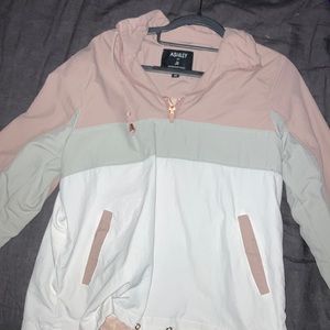 Pink and white pull over windbreaker